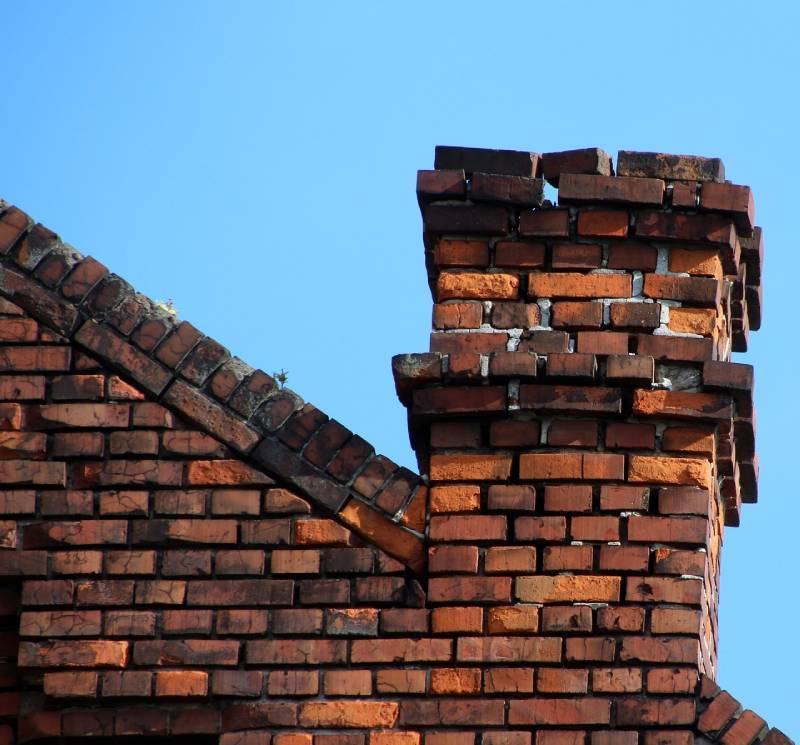 Signs Your Weston Home Needs a Chimney Inspection Damaged chimney on an Weston home showing cracks and missing mortar